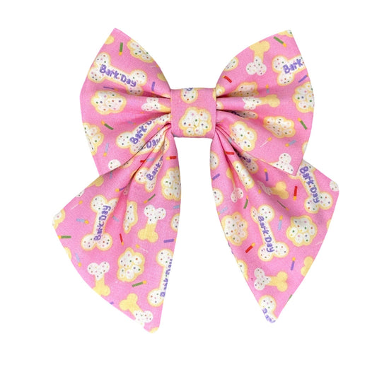 Pink dog bow with birthday treat print