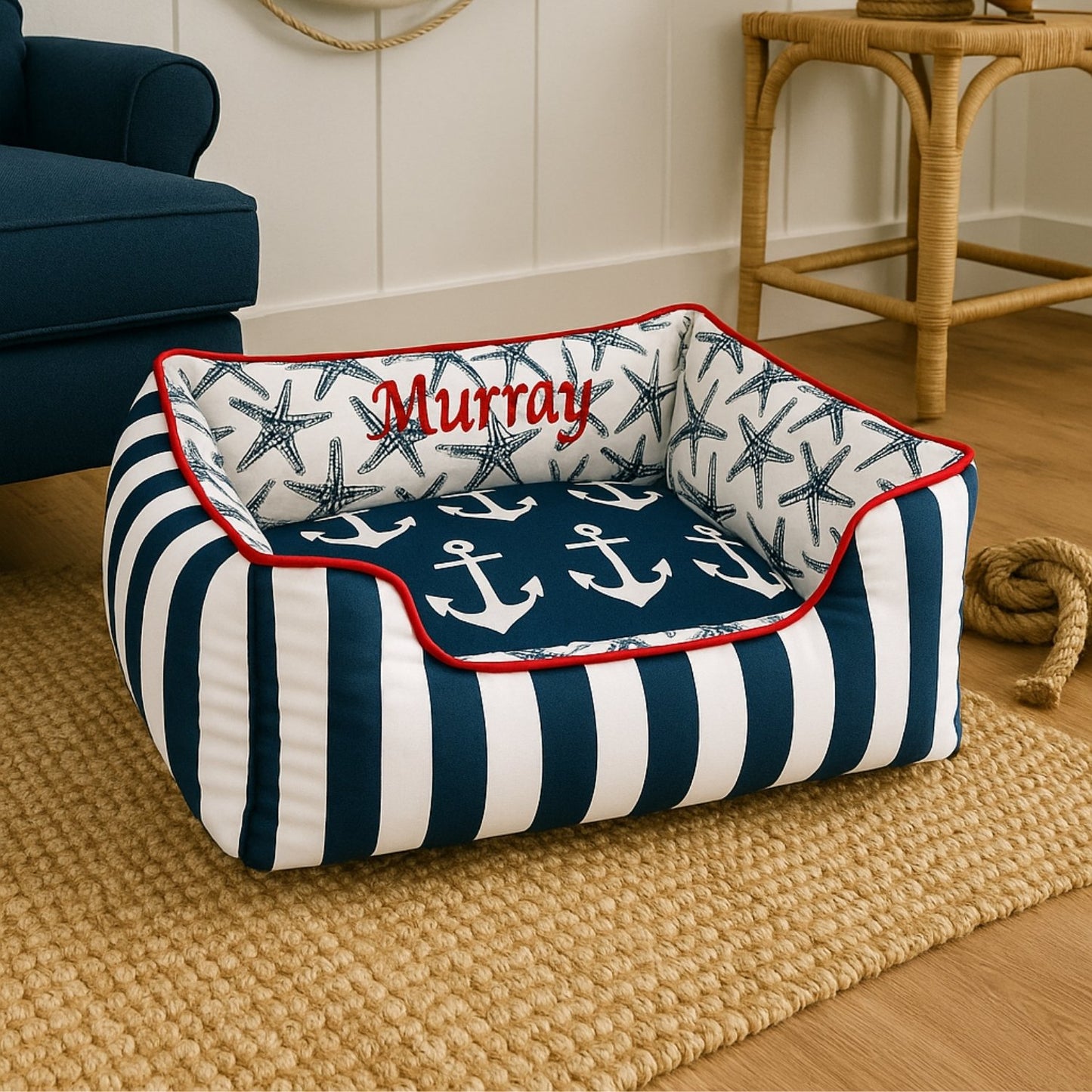 navy and white striped dog bed trimmed in red with a red custom name embroidery