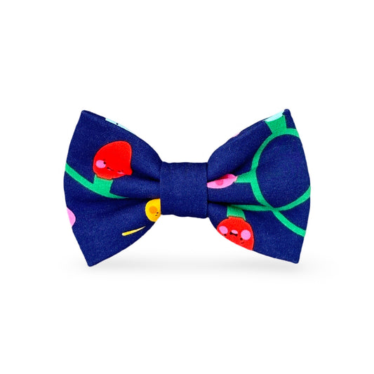 blue holiday bow tie with a Christmas light print on a navy background