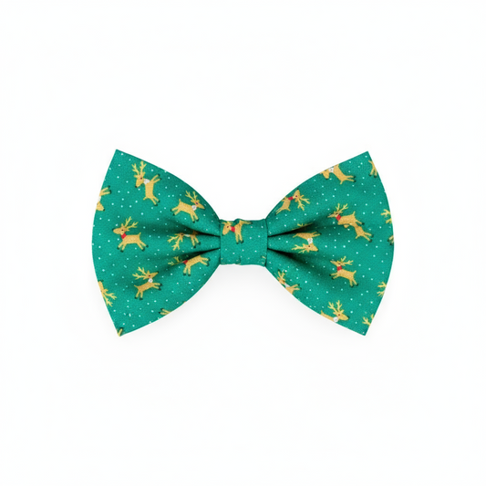 Green dog bow tie with reindeer pattern on a 